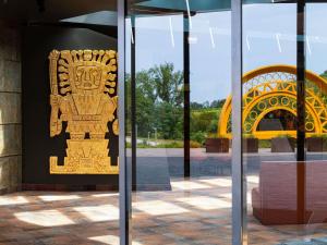 a gold sign on the side of a building at Minaro Hotel Tokaj - MGallery Collection - Adults Only in Tokaj