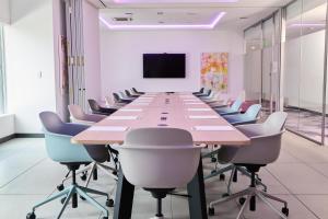 a large conference room with a long table and chairs at Yotel Miami, Select By Hilton in Miami +51 photos