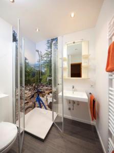 a bathroom with a shower and a sink at Landgasthof Zur Post, Hochwälder Radstation in Kell