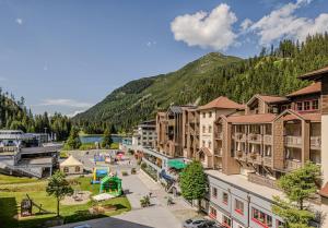 an aerial view of a town with a mountain at Hotel Zauchenseehof in Zauchensee