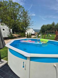 a small pool with a sink in a backyard at Glamping Agro Marzenie in Krajno Pierwsze