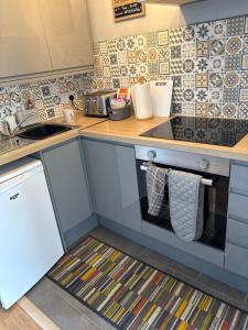 a kitchen with a sink and a counter with towels at 78 Belle Aire in Hemsby