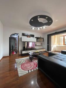 a living room with a couch and a rug at Cosy Home Apartament in Craiova