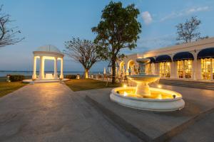 a large building with a fountain in front of it at Kaysorn Siri in Ban Kham Kom +66 photos
