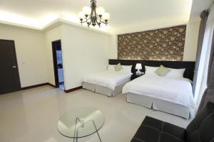 Llit o llits en una habitació de Yuli Happiness B&B花蓮縣民宿2068號