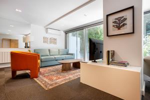 a living room with a couch and a tv at NOA - Sungu 1 in Istanbul +142 photos