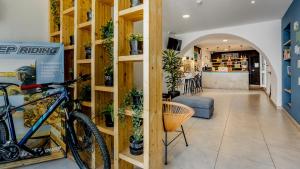 a bike parked in a room with shelves at Carmo Suites in Faro