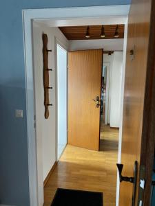 a hallway with a wooden door in a room at Privathaus Sieglinde in Sondermoning +8 photos