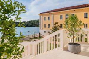 a balcony with a view of the water at Monumenti Heritage Hotel&Resort in Pula