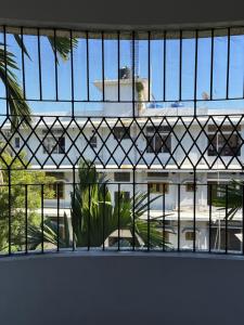 a view of a building through a window at Mi casa homestay in Guwahati