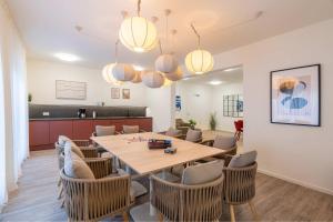 a dining room with a table and chairs at FeWo Tommy in Zirchow