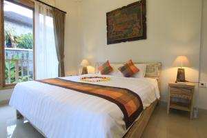 Postel nebo postele na pokoji v ubytování Gading Homestay Ubud + 31 fotografií