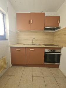 an empty kitchen with a sink and a stove at Refuge Gaillard Tramway in Gaillard