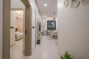 a hallway with a room with a bed and a television at الاخشبان in Jeddah +226 photos