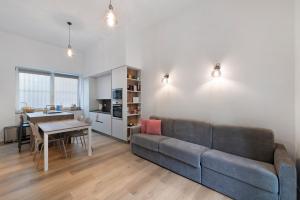 a living room with a couch and a table at Casa Vacanze Regina in Lecco