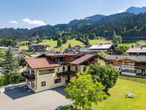 an aerial view of a village with mountains in the background at Appartements am Römerweg in Oberndorf in Tirol