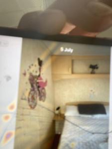 a dirt bike on the wall of a room at D andJ caravan in Winthorpe