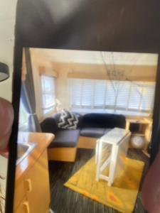 a view of a living room with a couch at D andJ caravan in Winthorpe