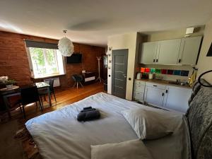 a bedroom with a bed with a bag on it at R.Wolf castle in Gulbene