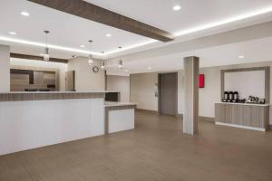 a large room with a kitchen and a counter top at Super Inn in Sulphur