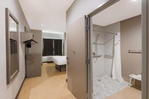 a bathroom with a shower and a walk in shower at Super Inn in Sulphur