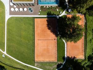 an overhead view of a tennis court in a yard at Suvretta House in St. Moritz +136 photos