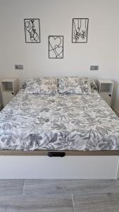 a bed in a white room with a mattress at Praciña do olvido in Cee