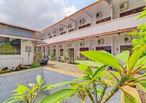 an exterior view of a building with plants at Ari Gusti Residence in Dalung