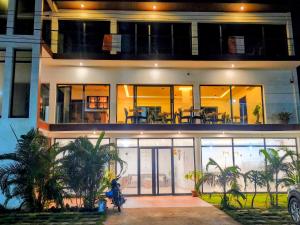 a large house with people standing in front of it at Junto Al Mar - Mini suite in San-Pédro