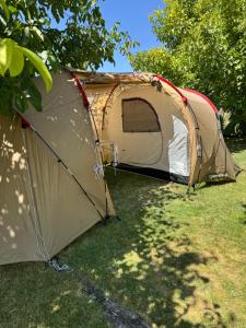 a tent sitting in the grass in a field at Eclipse 2026 in Tamarón +15 photos