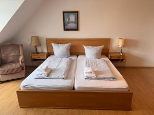 Katil atau katil-katil dalam bilik di Hotel Rademacher