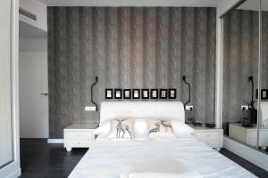 Postel nebo postele na pokoji v ubytování Apartamento Atico Real Suites
