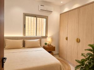 a bedroom with a bed and a window at house for rent in Saly Portudal