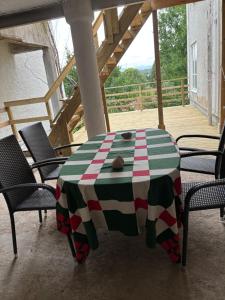 a green and white table with chairs on a porch at Storgatan 42 in Högsby