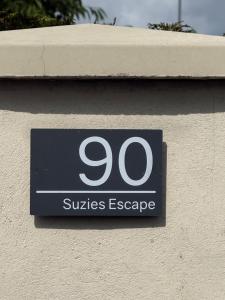 a sign on the side of a building at Suzies Escape in Bovevagh