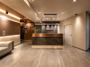a lobby with a reception desk in a building at Hotel Arashi Nippombashi 2 No008 in Osaka