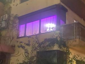 a window with purple lights in a building at RC RelaxApart 4 in Dudu