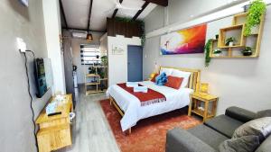 a bedroom with a bed and a couch at Blairgowrie Skyline in Johannesburg