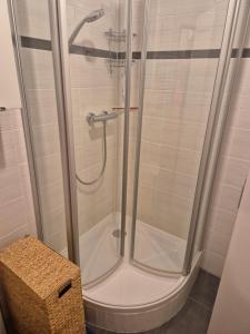 a shower with a glass door in a bathroom at Ruhiges Nest in Bad Endorf +9 photos