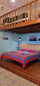a bed in the middle of a room at Villa la Milanina in Lipari
