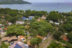 an aerial view of a town with trees and the ocean at Club Voca 5 in Coco