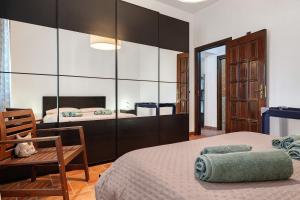 a bedroom with a bed and a large mirror at Dal Cappellaio Matto in Taranto