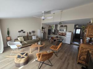 a living room with a couch and a table at Chez mamie in La Rochelle +10 photos