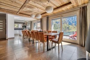a dining room with a table and chairs at Spacious Apartment in Tignes in Tignes