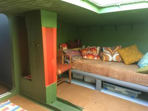 a living room with a couch in a room at Houseboat Zeldenrust in West Mersea