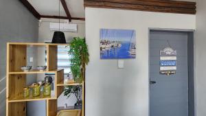 a room with a door and a shelf with a picture at Blairgowrie Skyline in Johannesburg