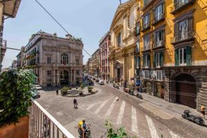 an empty street in a city with buildings at Toledo 16 Luxury Suites in Naples