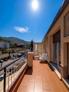 a balcony with a view of a city at Attico al Centro in Cefalù
