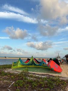 a group of kayaks sitting on the beach at Pousada Roane - Taíba in Taíba