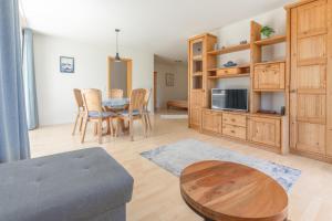 a living room with a table and a dining room at Ferienwohnung Ledergerber in Bodman-Ludwigshafen